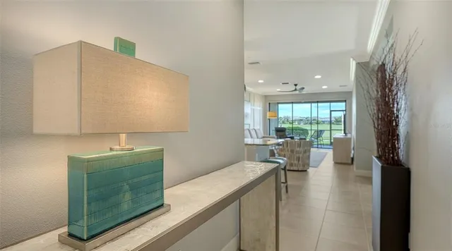 a room with a couch and a view of living room