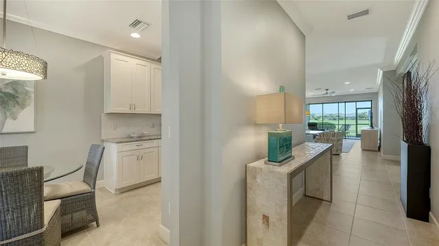 a kitchen with a table and chairs