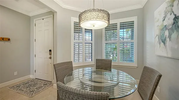 a kitchen with stainless steel appliances granite countertop a refrigerator a stove and a sink