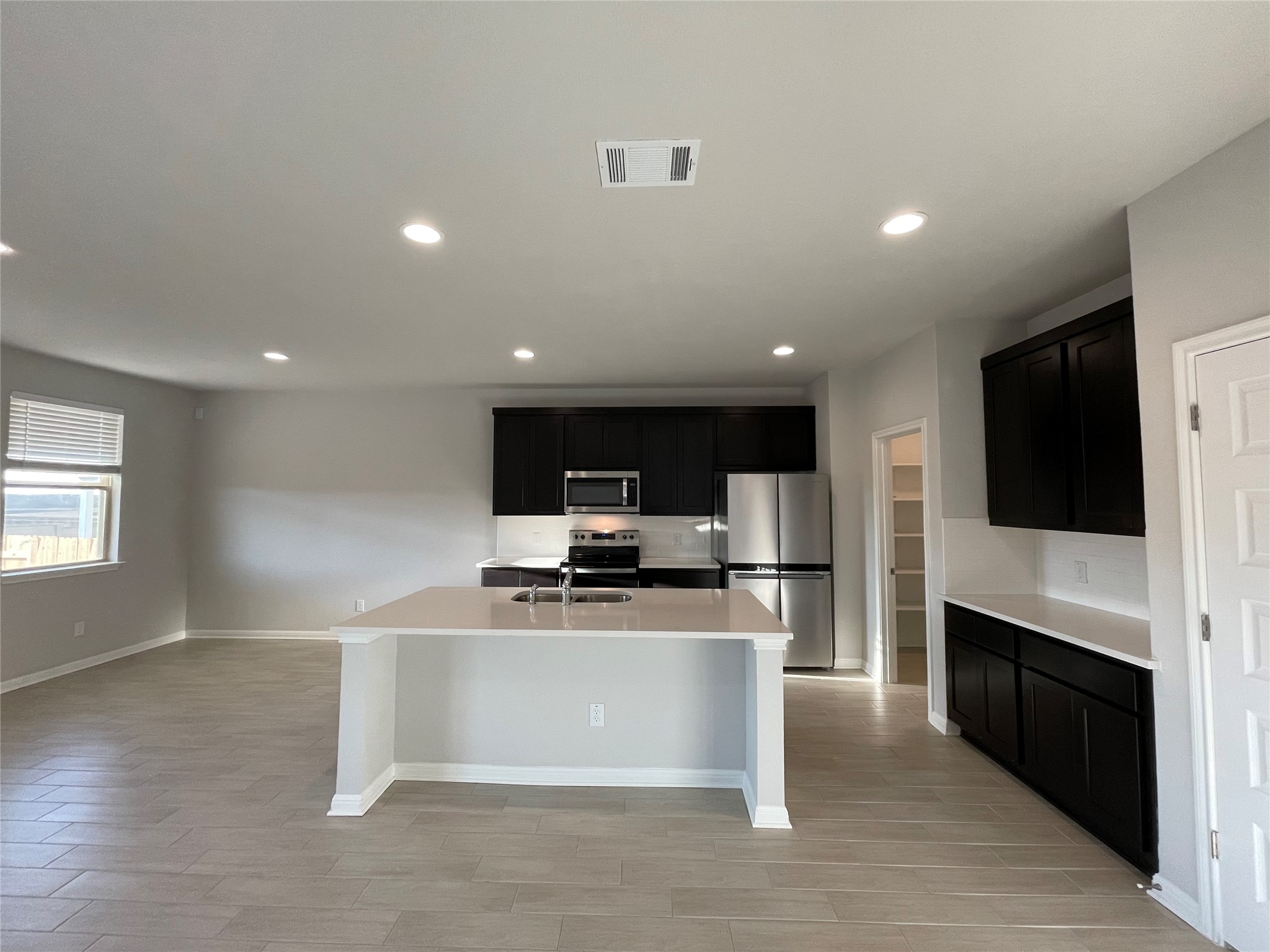 125 Old Stagecoach Road Jarrell, TX 76537 - Photo 11 of 31 a view of kitchen with microwave stove refrigerator and cabinets