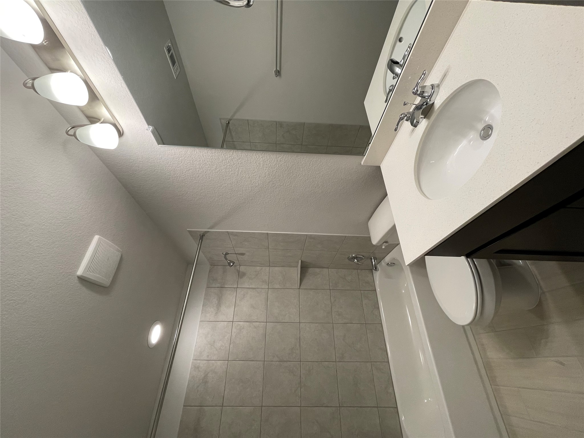 125 Old Stagecoach Road Jarrell, TX 76537 - Photo 20 of 31 a bathroom with a sink a toilet and shower