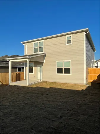 a view of house with backyard