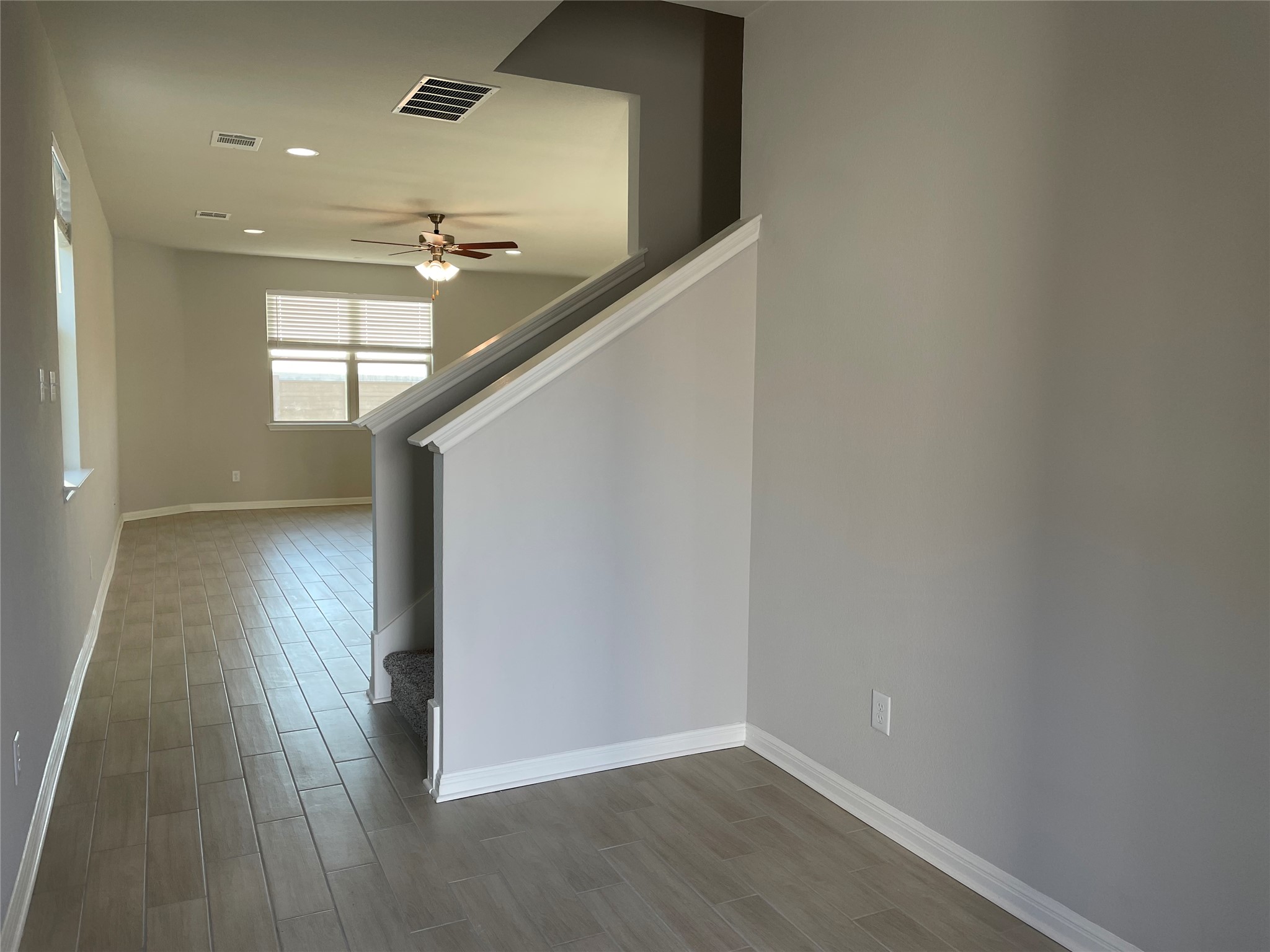 125 Old Stagecoach Road Jarrell, TX 76537 - Photo 6 of 31 a view of hallway with stairs and wooden floor