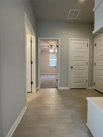 a view of an empty room with closet