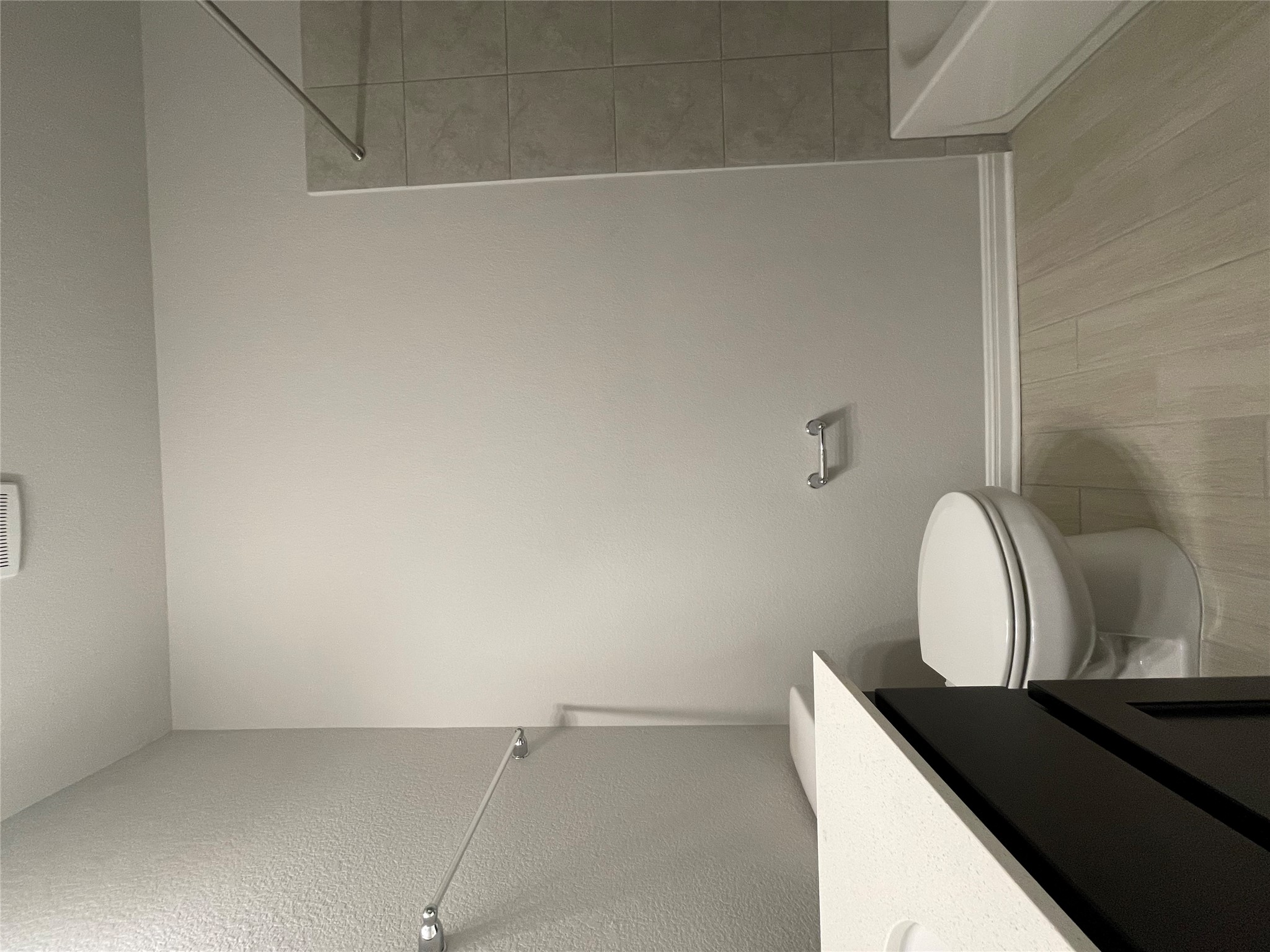 125 Old Stagecoach Road Jarrell, TX 76537 - Photo 8 of 31 a white toilet sitting next to a bath tub