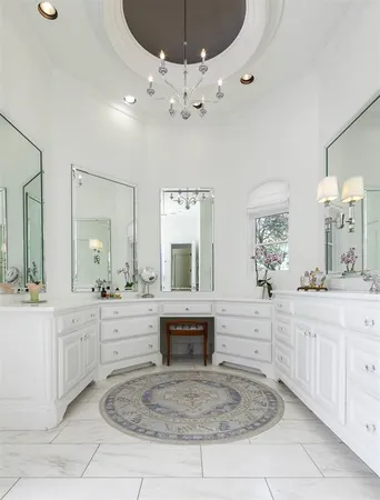 a spacious bathroom with a sink and a mirror
