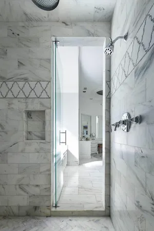 a bathroom with a granite countertop shower