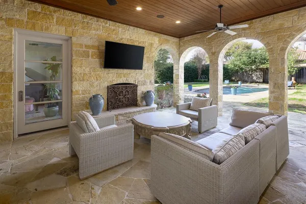 a living room with fireplace furniture and a flat screen tv