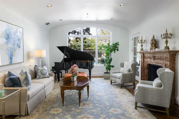 a living room with furniture and a fireplace