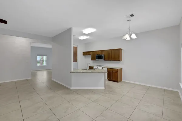 a view of kitchen with sink and microwave