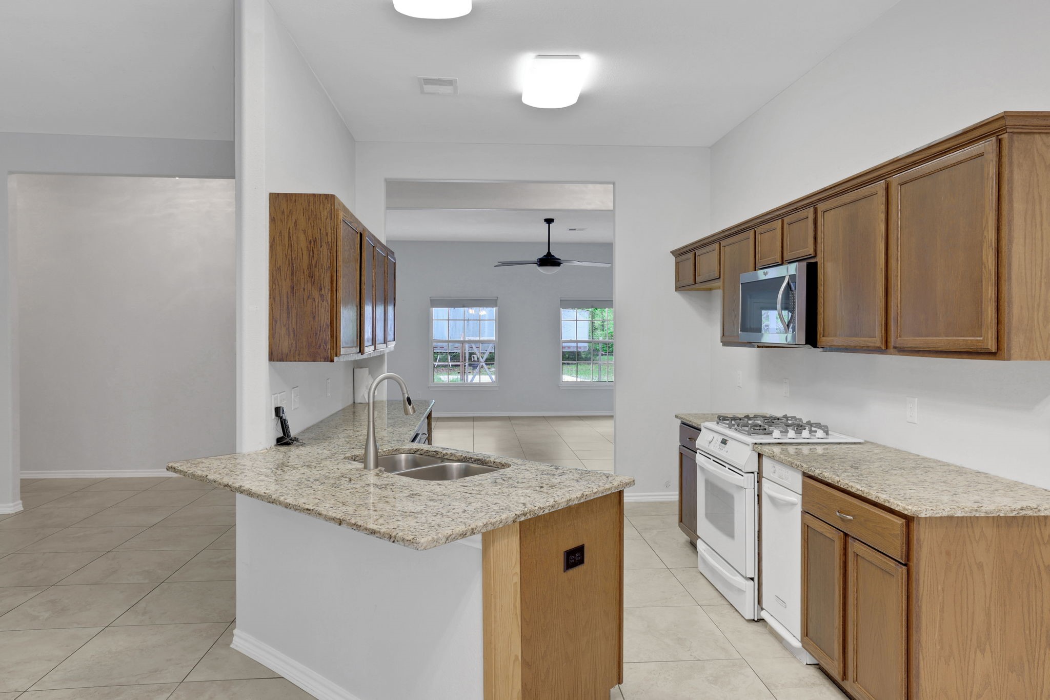 1290 Spring Ridge Road Coldspring, TX 77331 - Photo 18 of 49 The kitchen has a breakfast bar and granite countertops