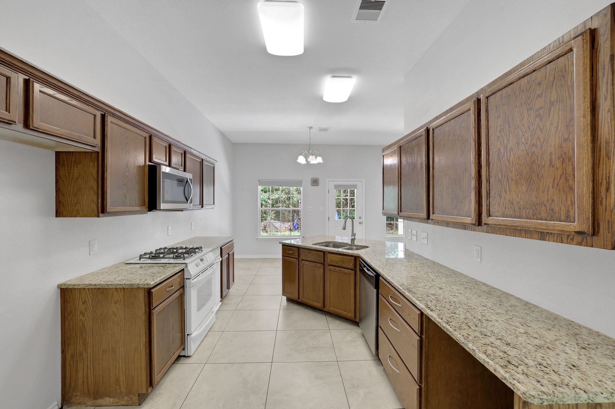 1290 Spring Ridge Road Coldspring, TX 77331 - Photo 19 of 49 Kitchen with breakfast area behind it