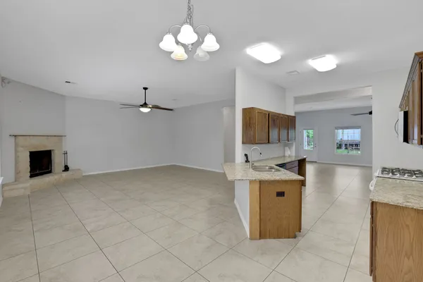 a view of livingroom with kitchen island furniture and flat screen tv