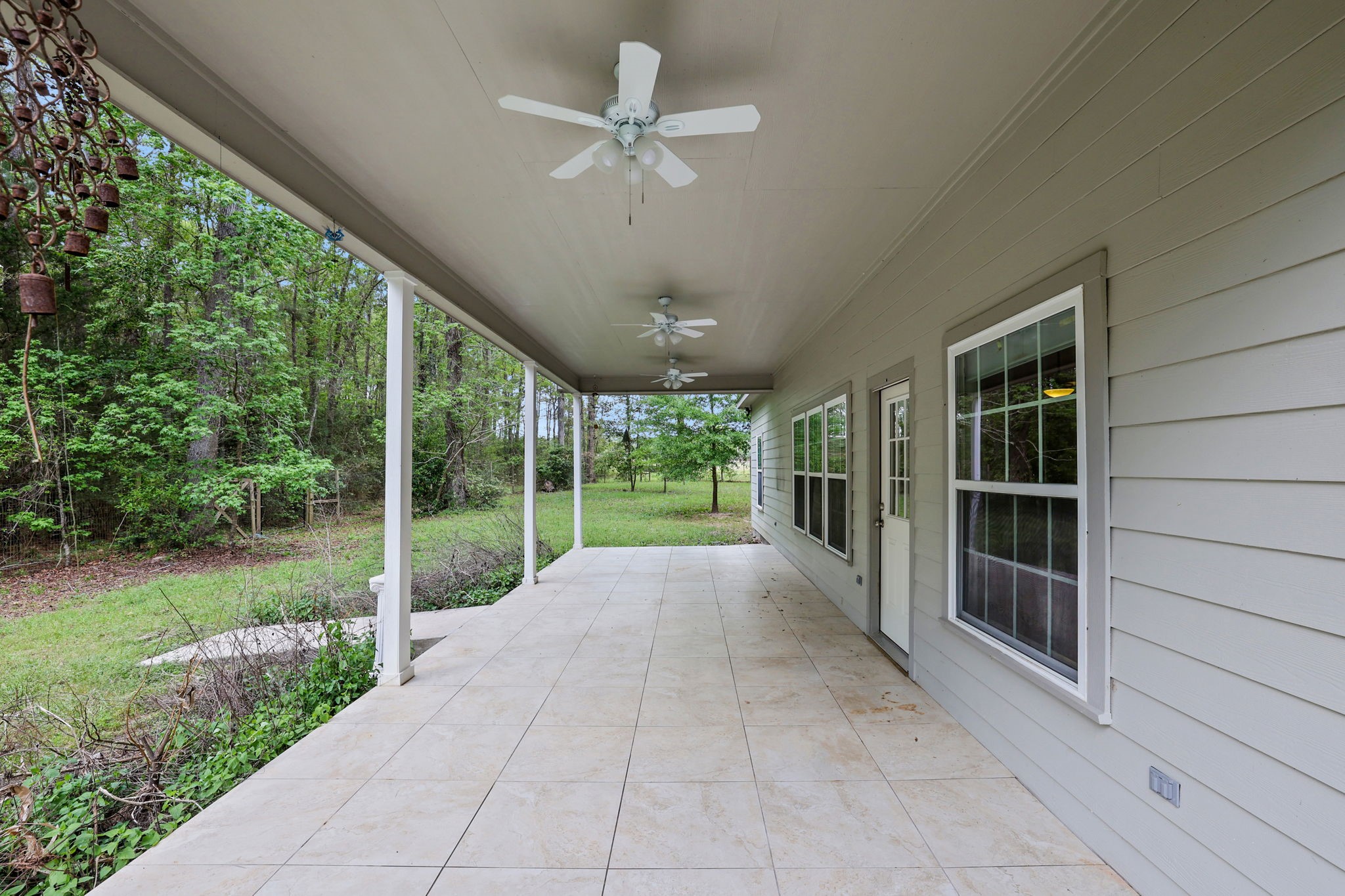 1290 Spring Ridge Road Coldspring, TX 77331 - Photo 21 of 49 From the living area, step out to the covered back patio with newly installed ceiling fans