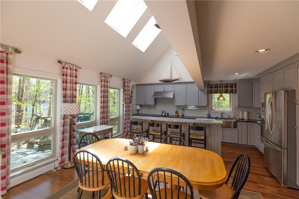 Fl59 Mountain Road Denmark, ME 04022 - Photo 21 of 57 Skylights keep this room bright and...