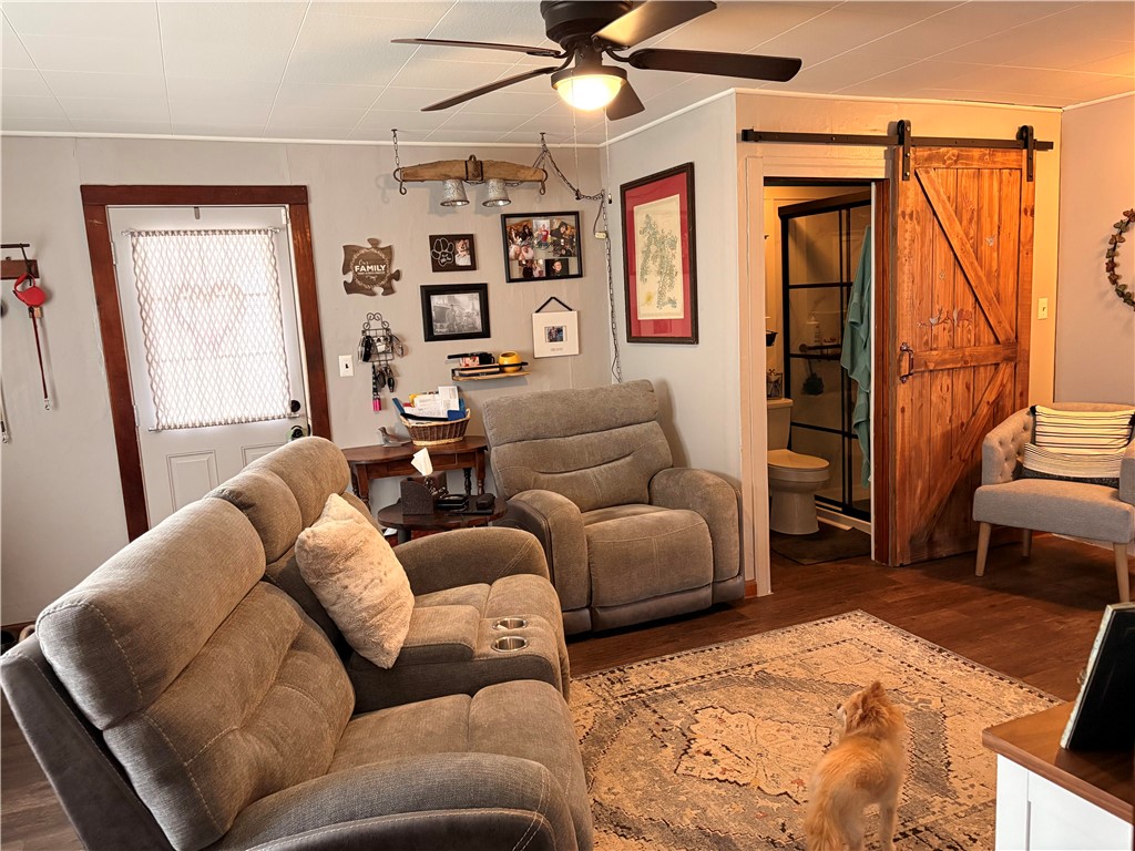321 Liberty Street Eaton, OH 45320 - Photo 21 of 34 This inviting living space features warm hardwood floors and a convenient barn door entry.