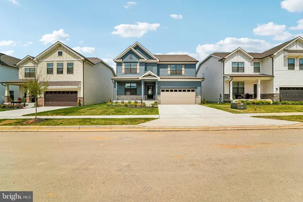 a front view of residential houses with yard and swimming pool