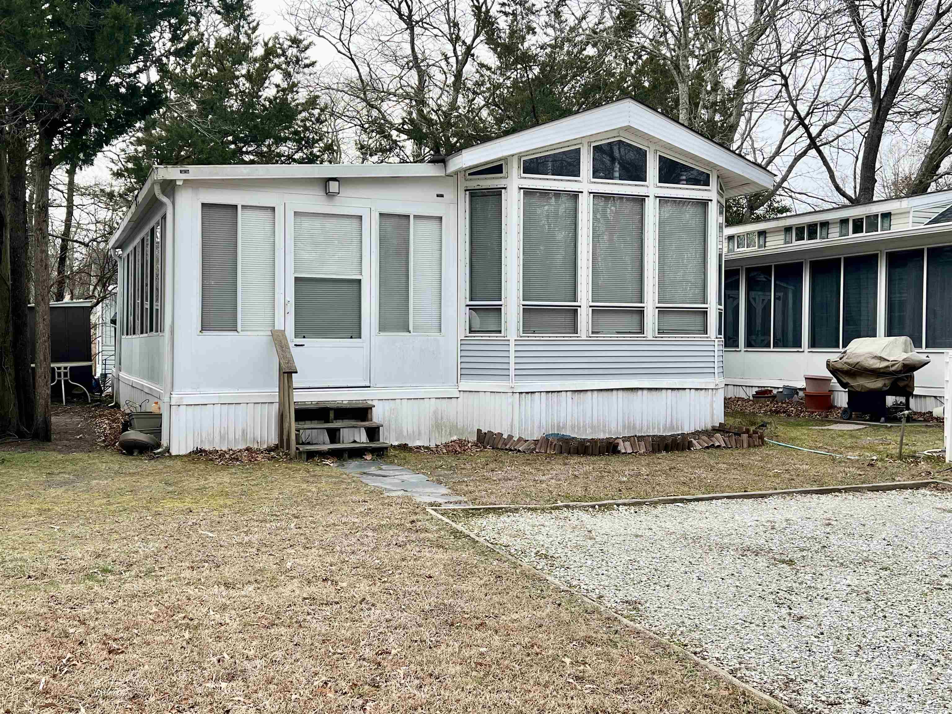 709 Seashore Road Cape May, NJ 08204 - Photo 1 of 29 a view of a house with a yard and large trees
