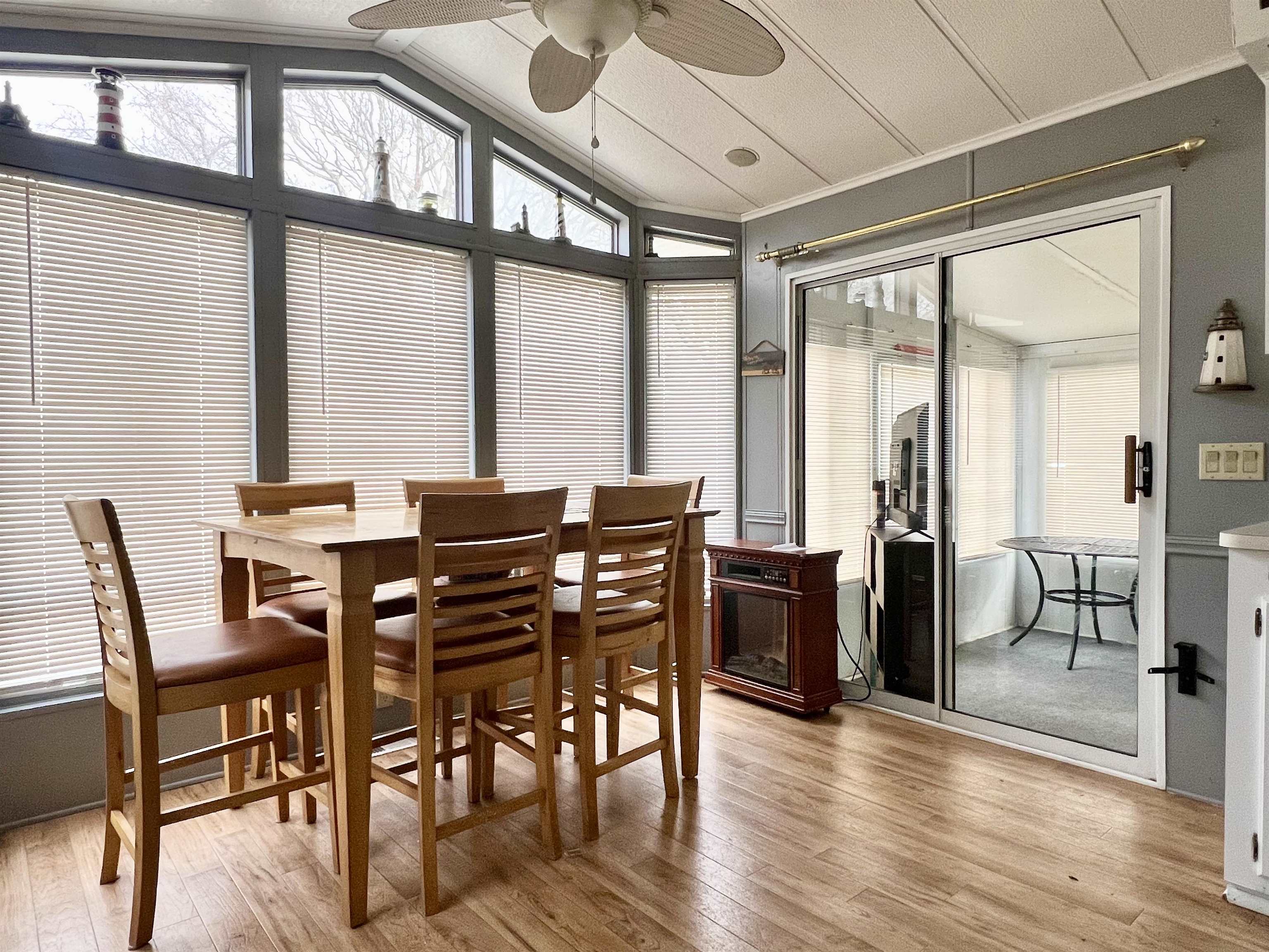 709 Seashore Road Cape May, NJ 08204 - Photo 13 of 29 a view of a dining room with furniture window and wooden floor