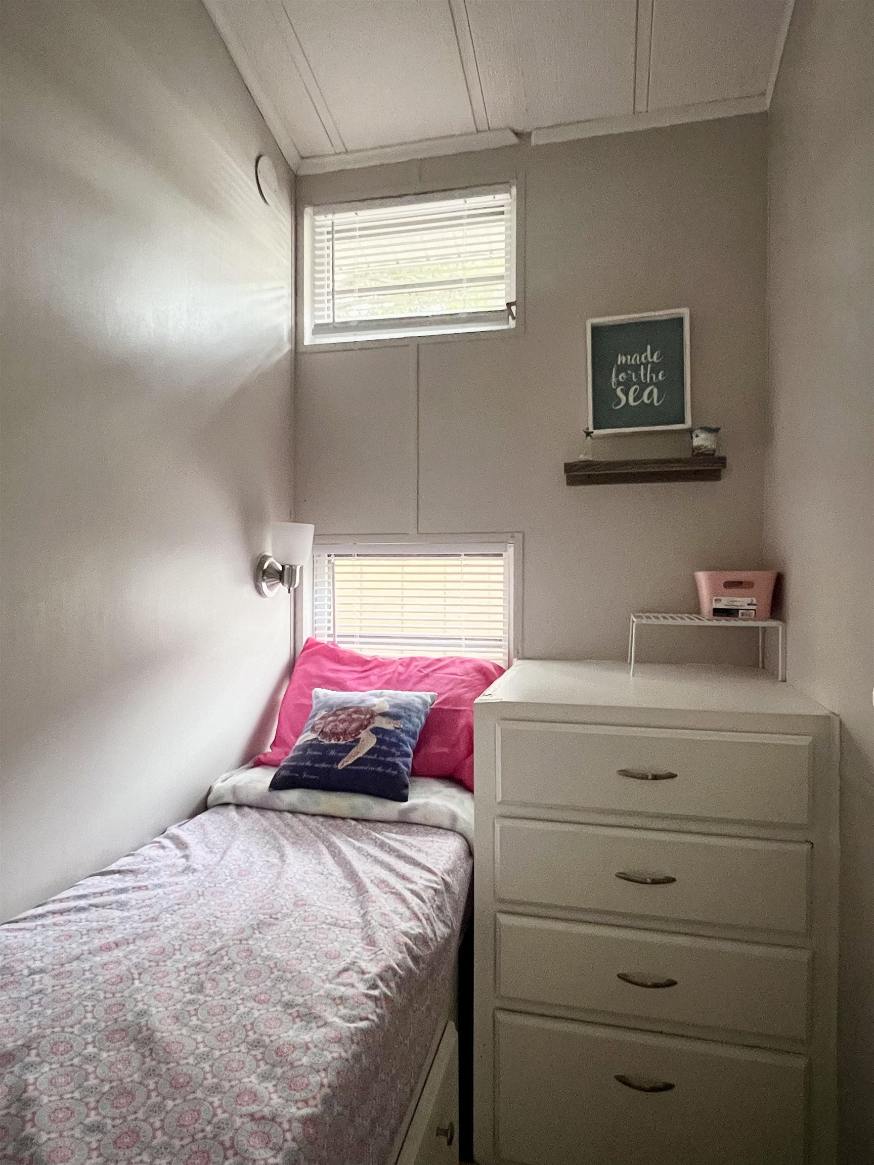 709 Seashore Road Cape May, NJ 08204 - Photo 16 of 29 a bedroom with a bed and a dresser