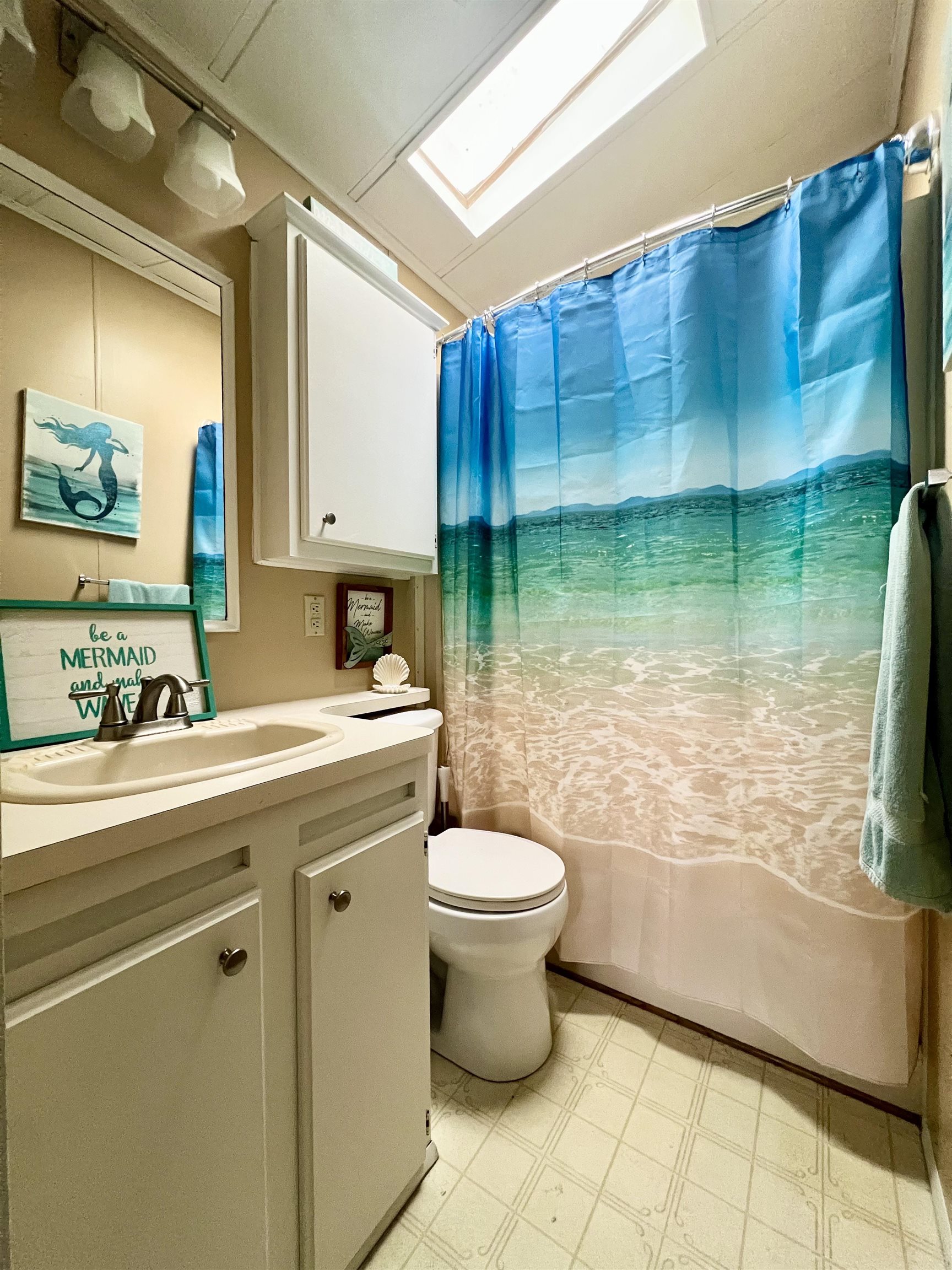 709 Seashore Road Cape May, NJ 08204 - Photo 19 of 29 a bathroom with a sink toilet and shower