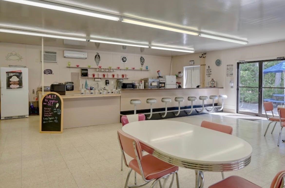 709 Seashore Road Cape May, NJ 08204 - Photo 25 of 29 a kitchen with stainless steel appliances granite countertop a stove a sink and a refrigerator