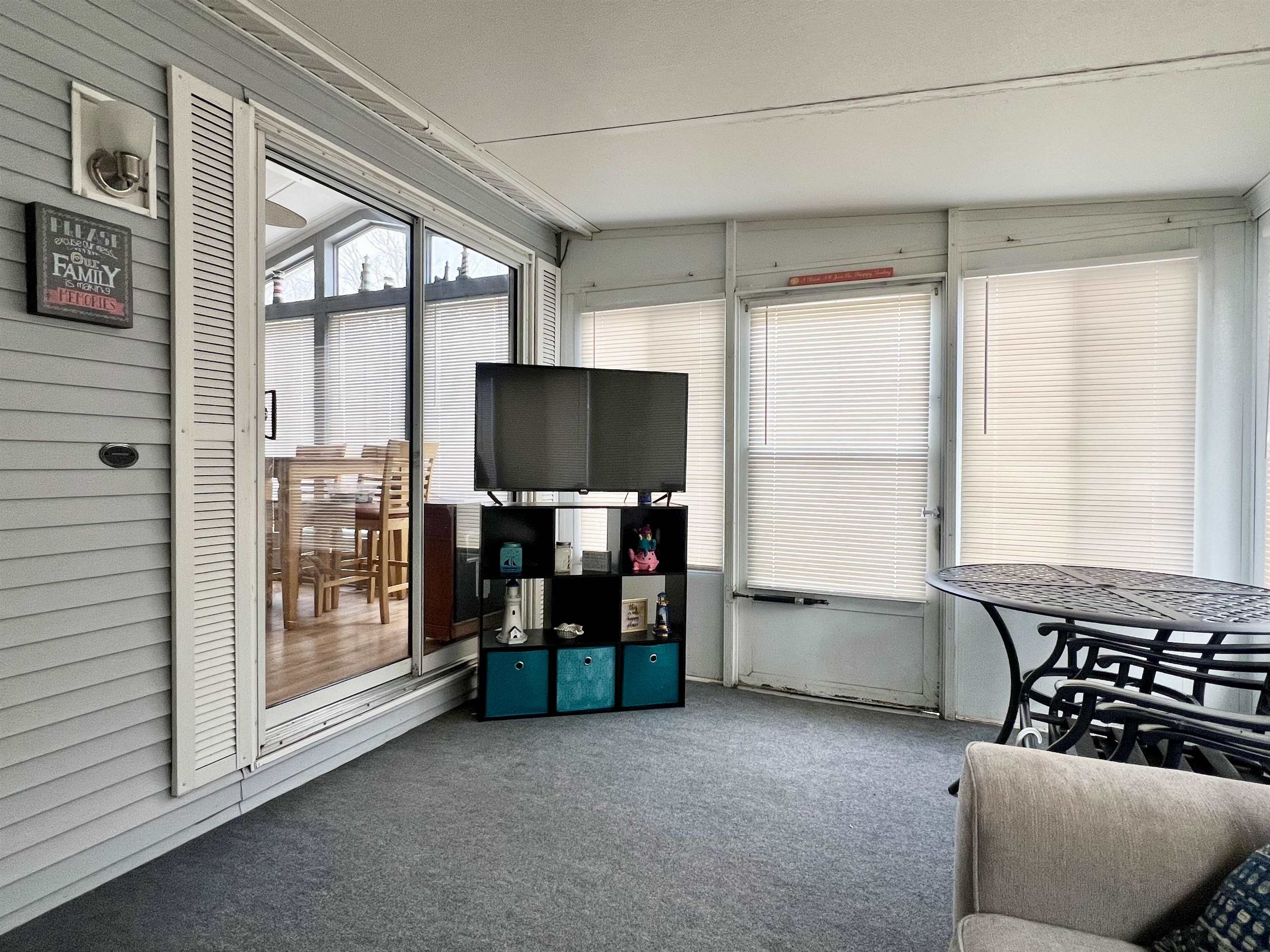 709 Seashore Road Cape May, NJ 08204 - Photo 3 of 29 a living room with furniture and a flat screen tv