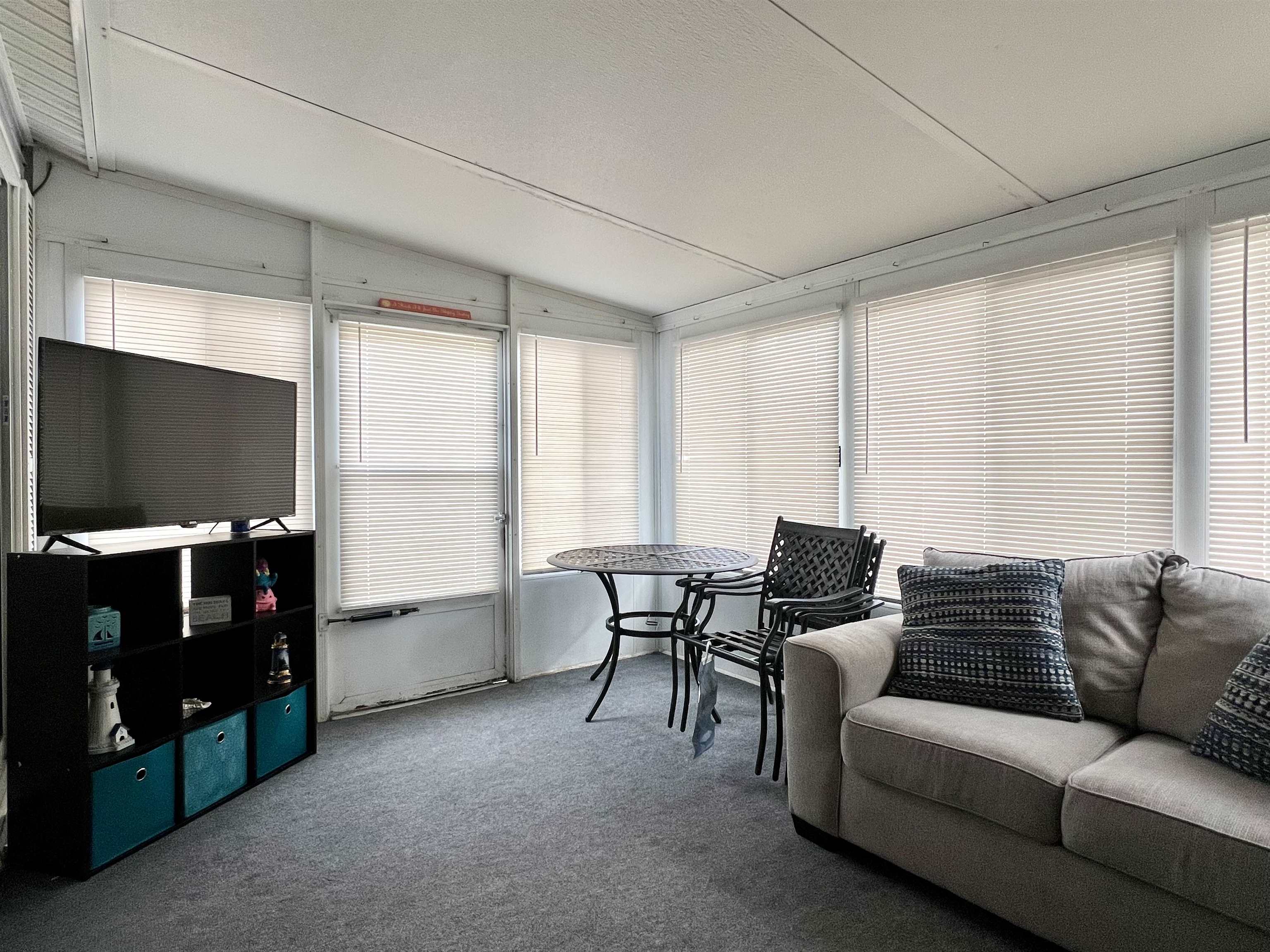709 Seashore Road Cape May, NJ 08204 - Photo 6 of 29 a living room with furniture and a flat screen tv