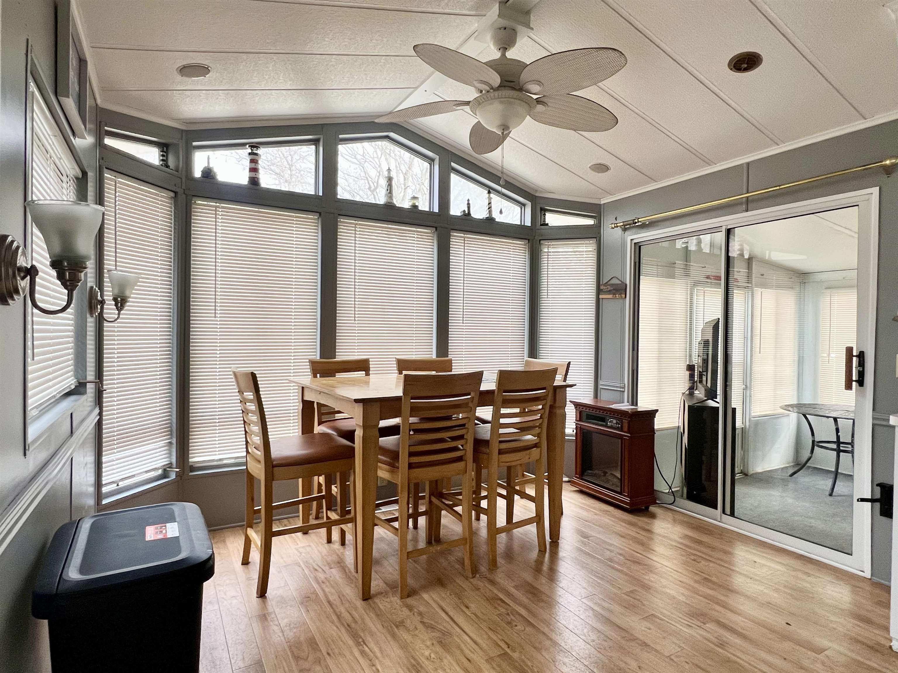 709 Seashore Road Cape May, NJ 08204 - Photo 9 of 29 a view of a dining room with furniture window and wooden floor