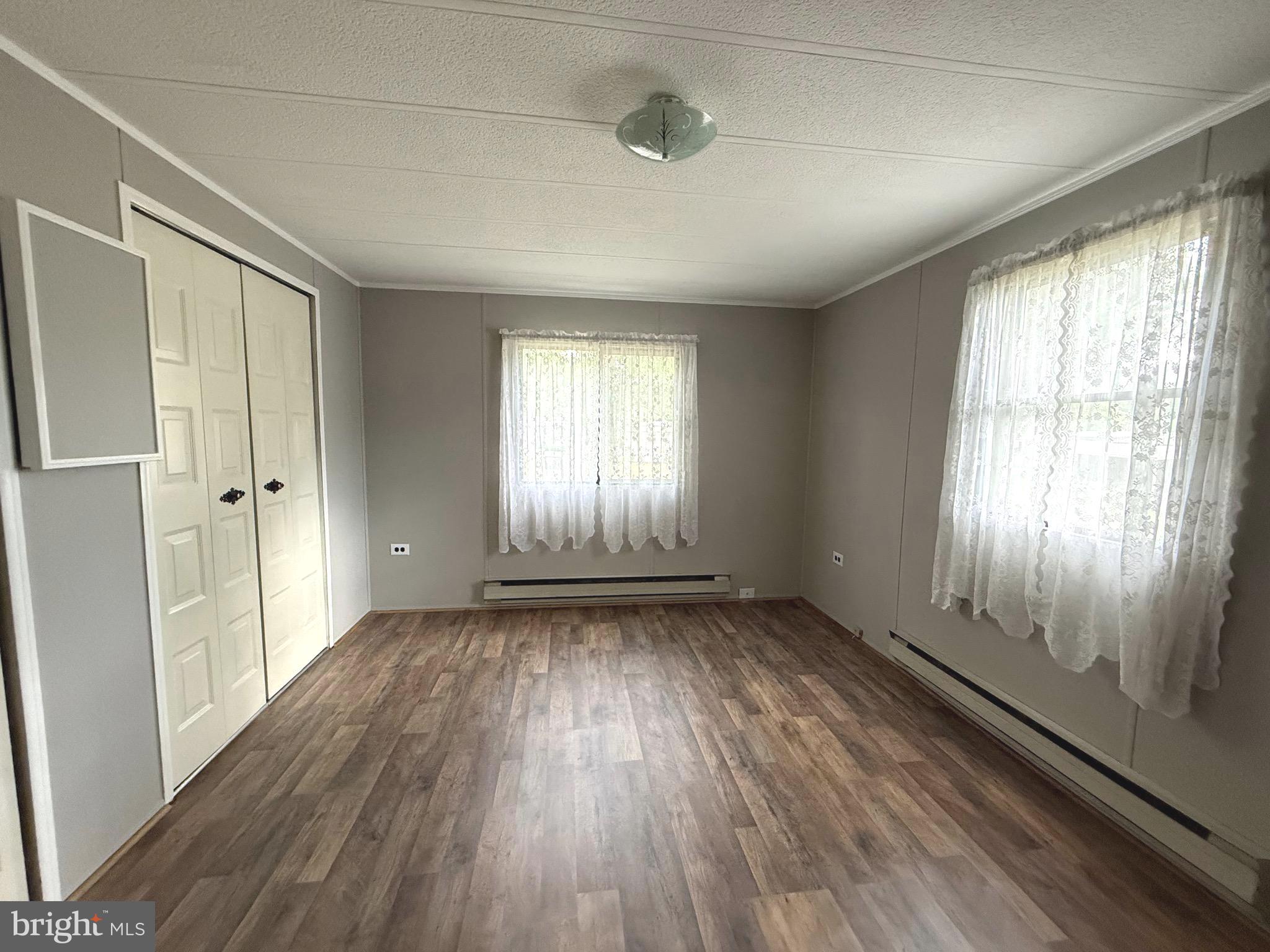 87 Holly Court Tabernacle, NJ 08088 - Photo 14 of 24 an empty room with wooden floor and windows