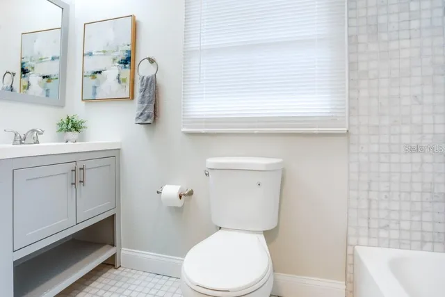 a bathroom with a shower and a bathtub