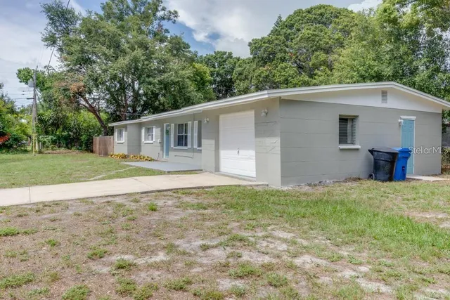 a backyard of a house with lots of green space