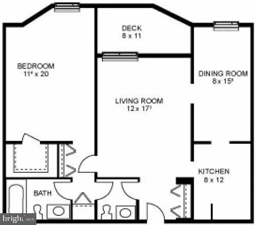 a lobby with a couch and a potted plant