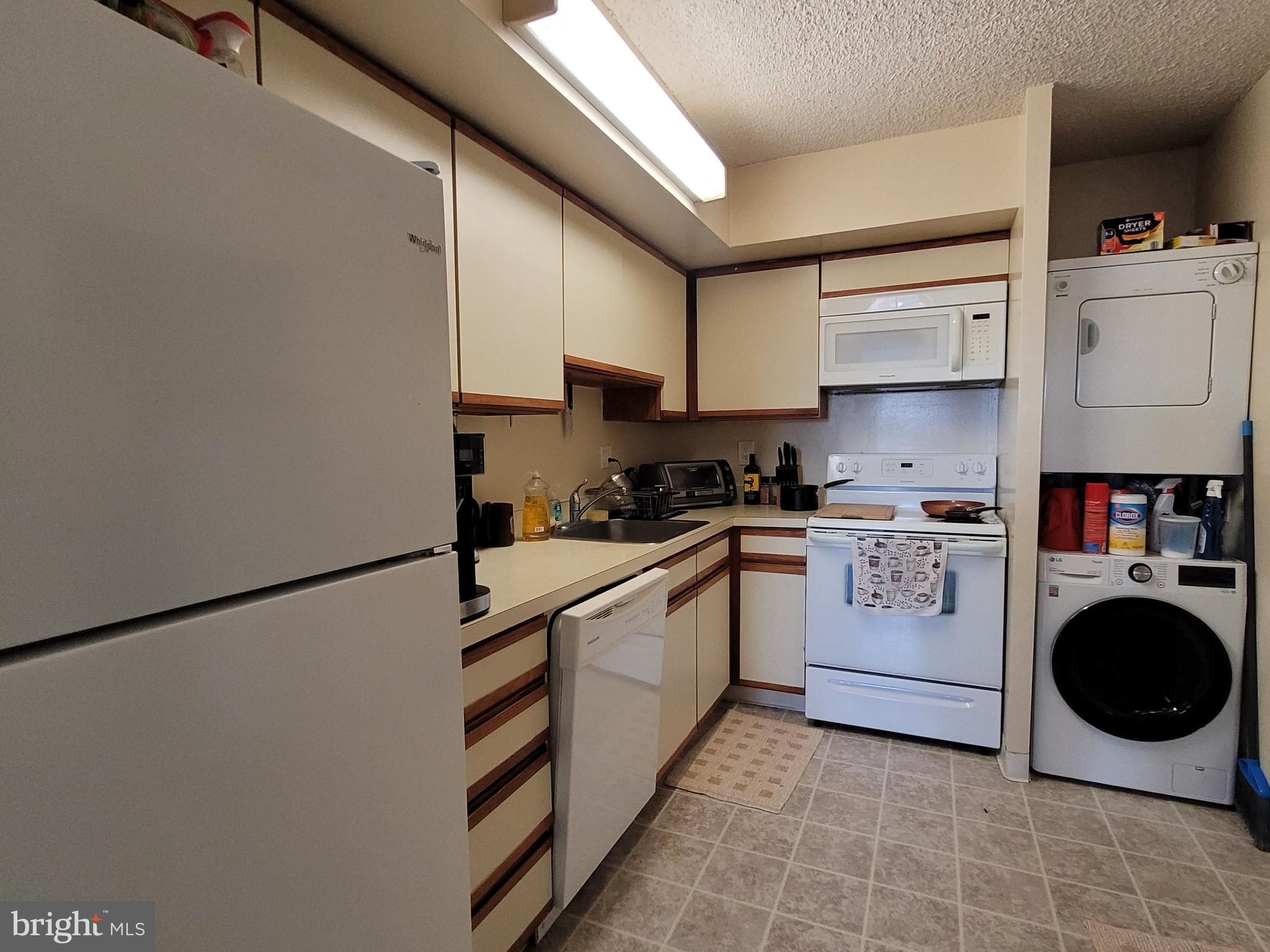 530 South 2nd Street, Unit 610 Philadelphia, PA 19147 - Photo 6 of 21 a kitchen with stainless steel appliances granite countertop a sink a stove a refrigerator and white cabinets
