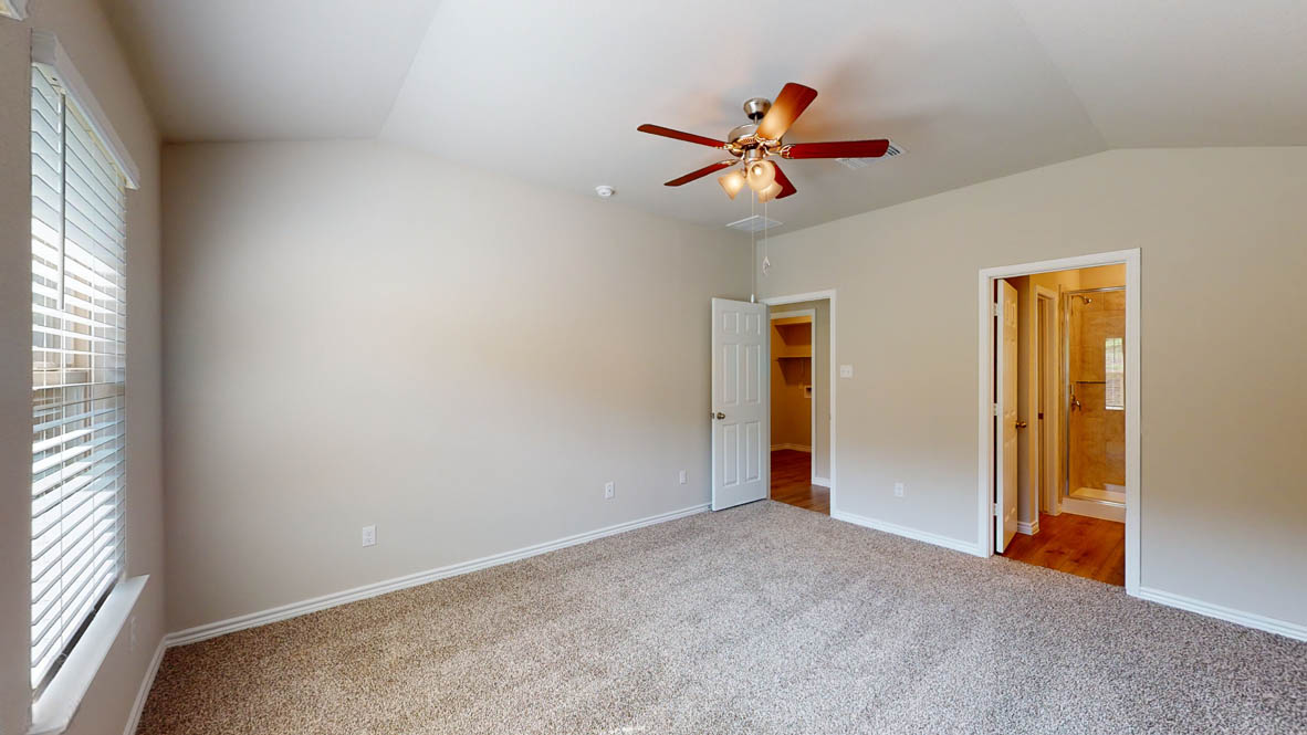 234 Water Wl Road Burnet, TX 78611 - Photo 13 of 28 an empty room and chandelier fan