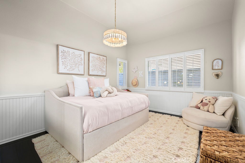 1 Via Colorso San Clemente, CA 92672 - Photo 17 of 24 a bedroom with a bed and a window with chair