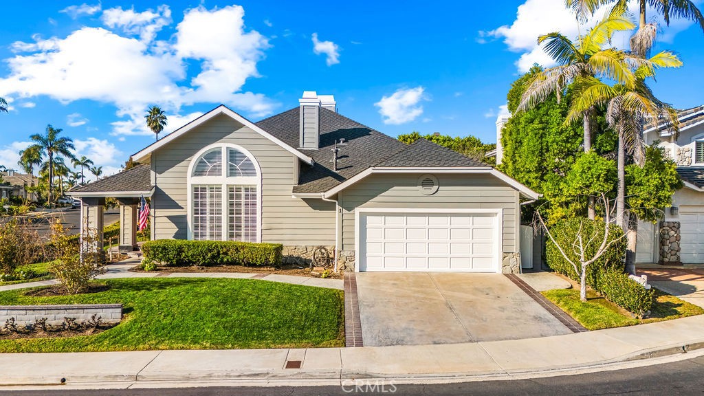 1 Via Colorso San Clemente, CA 92672 - Photo 22 of 24 a front view of a house with a yard and potted plants