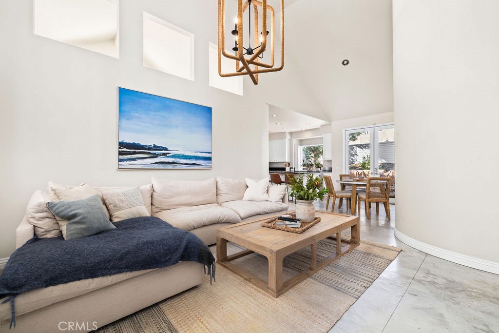 1 Via Colorso San Clemente, CA 92672 - Photo 4 of 24 a living room with furniture a rug and a wall painting