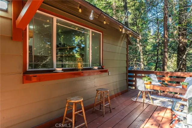 a view of patio with table and chairs and potted plants