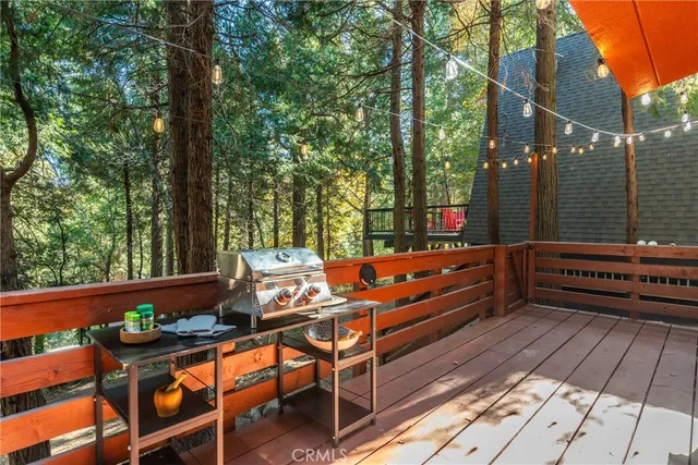 a outdoor sitting area with furniture and wooden floor
