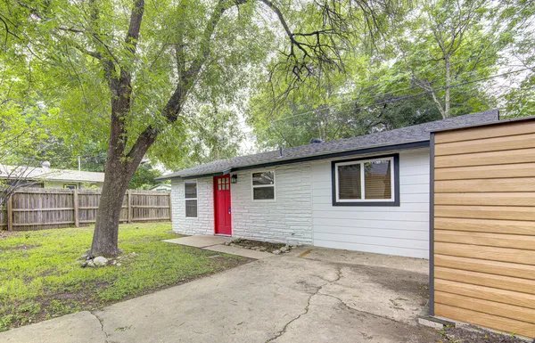 a backyard of a house with seating space