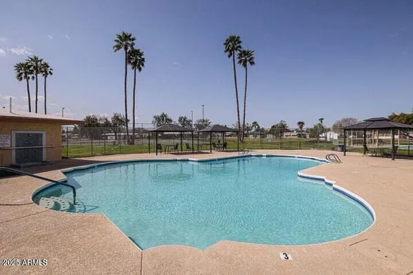 a view of a backyard with a patio