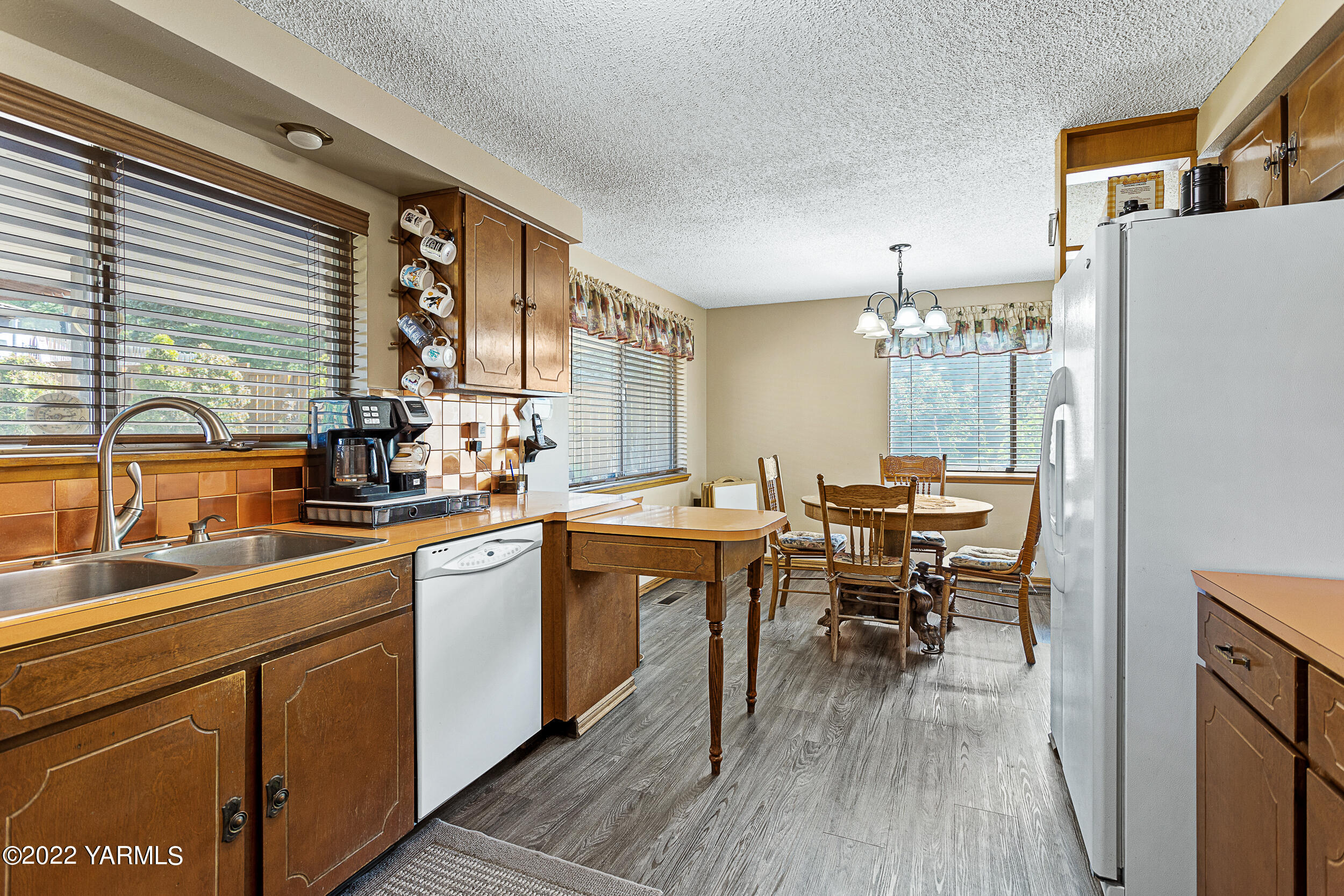 7401 Bittner Road Yakima, WA 98901 - Photo 18 of 55 a kitchen with a sink appliances and cabinets