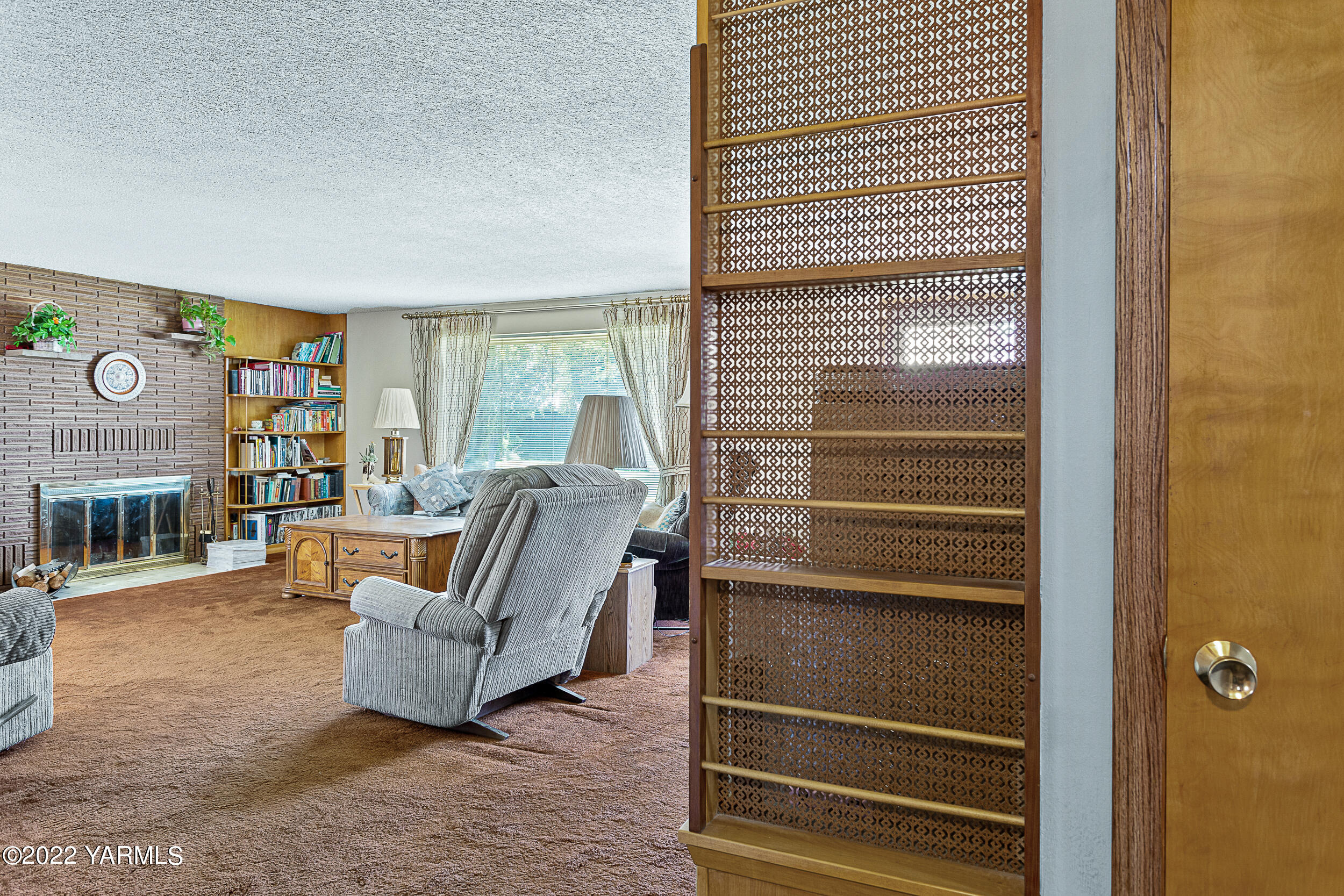 7401 Bittner Road Yakima, WA 98901 - Photo 19 of 55 a living room with furniture and a fireplace