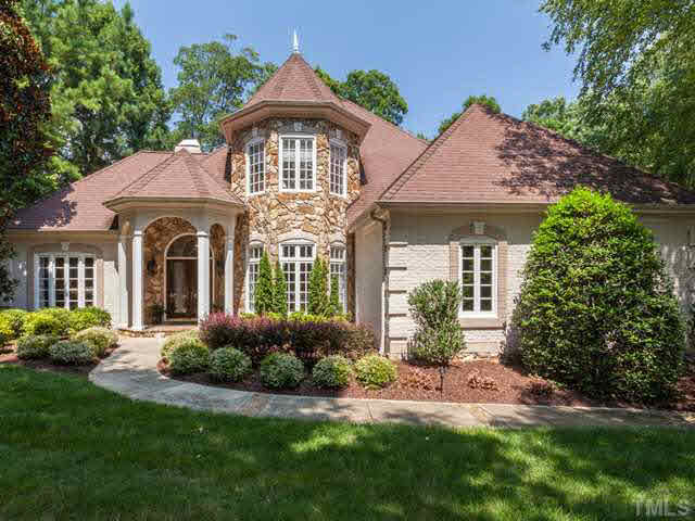 Welcome to 4612 White Chapel Way, an all brick and stone custom home with  a 2-story turret and a castle-like exterior.  Each front window is graced with a French fleur-de-lis. There is also a 3-car garage!