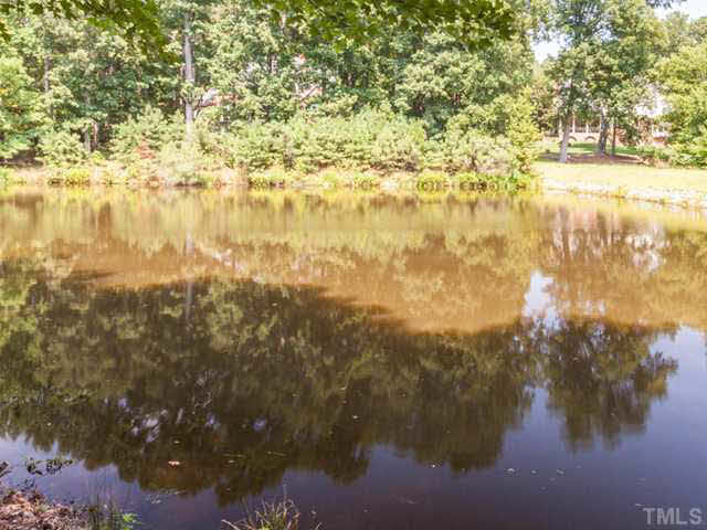 4612 White Chapel Way Raleigh, NC 27615 - Photo 23 of 25 What a rare treat to have property with a lovely pond in North Raleigh! A portion of this pond is actually on the property. Trespassing on the property to reach this section of the pond is prohibited. Sit back and relax as blue heron land by its edges!