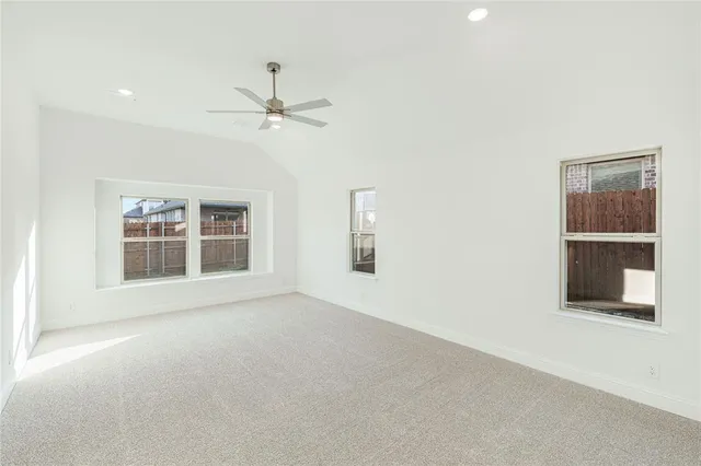 a large white bed in a white room