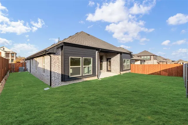 a picture of a bench in front of a building