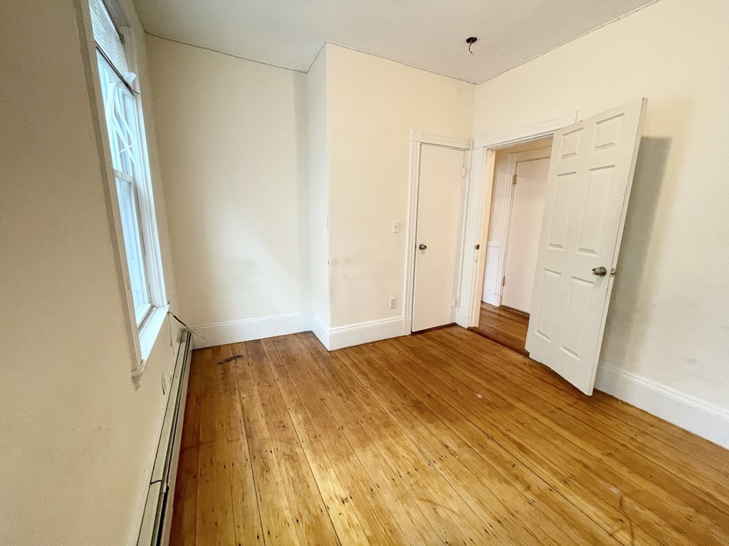 1 Folsom Avenue, Unit 1 Boston, MA 02120 - Photo 7 of 10 a bedroom with a bed and a window