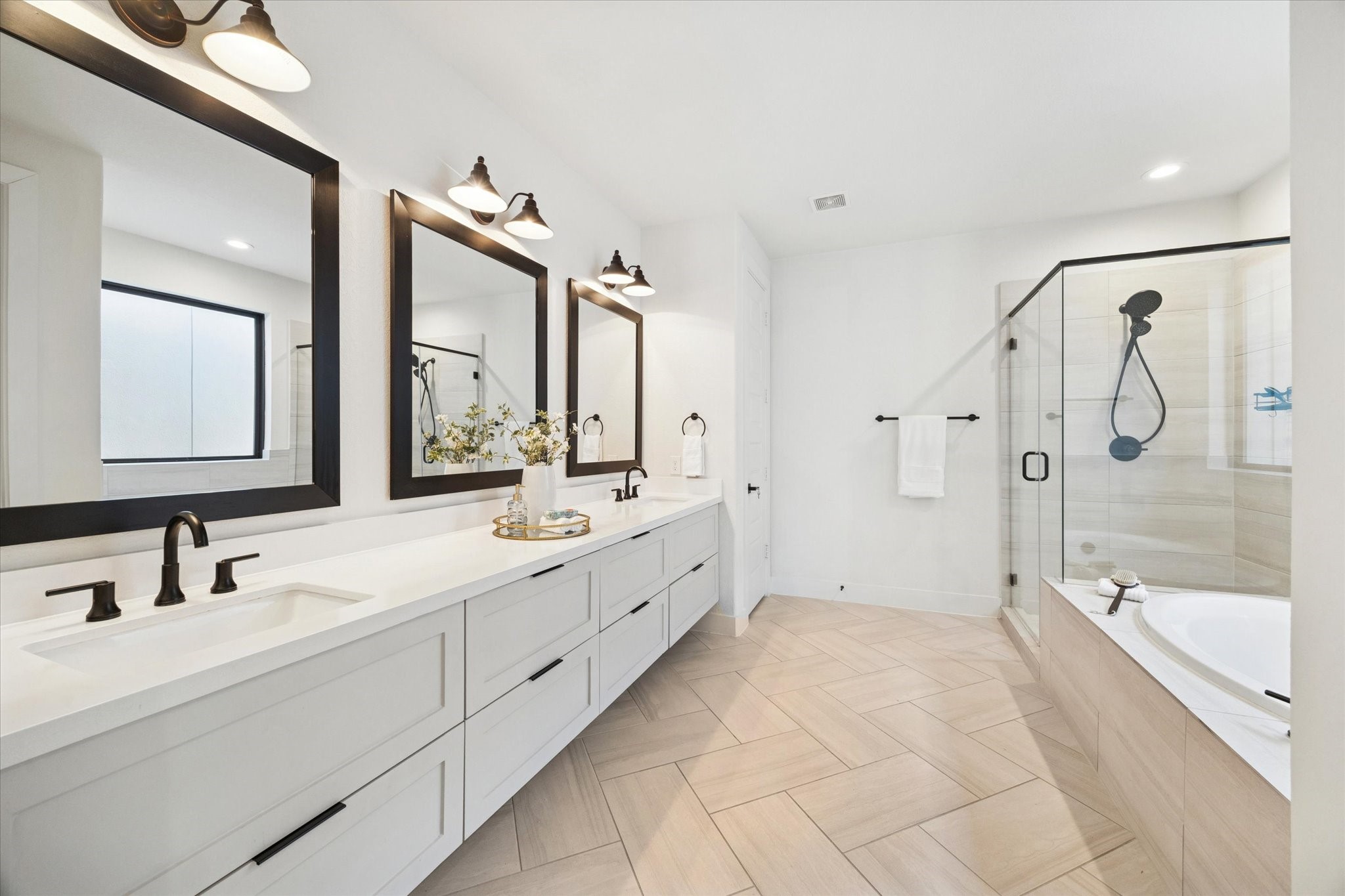 1122 Thompson Street Houston, TX 77007 - Photo 19 of 25 a spacious bathroom with double sink and a large mirror